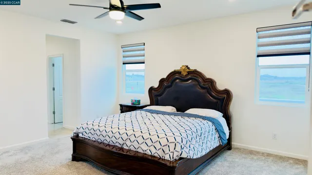 a view of a swimming pool with lawn chairs