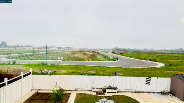 a bathroom with a double vanity sink mirror and bathtub