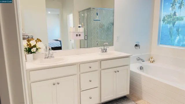 a bathroom with a sink a mirror and a bathtub