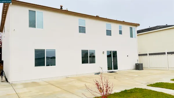 a view of a backyard with table and chairs