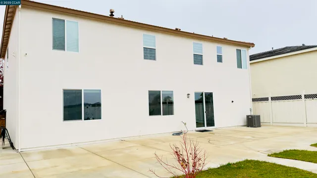 a view of a backyard with table and chairs