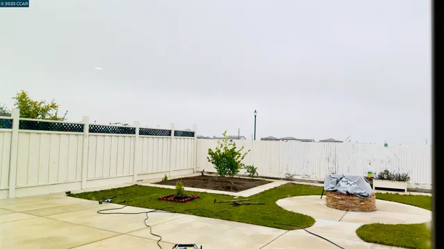 a view of a street with a cars park side of the road