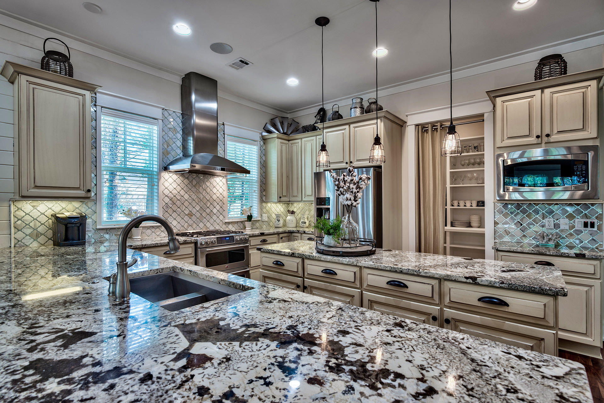 191 Plimsoll Way Santa Rosa Beach, FL 32459 - Photo 12 of 49 a kitchen with granite countertop a stove a sink and a refrigerator