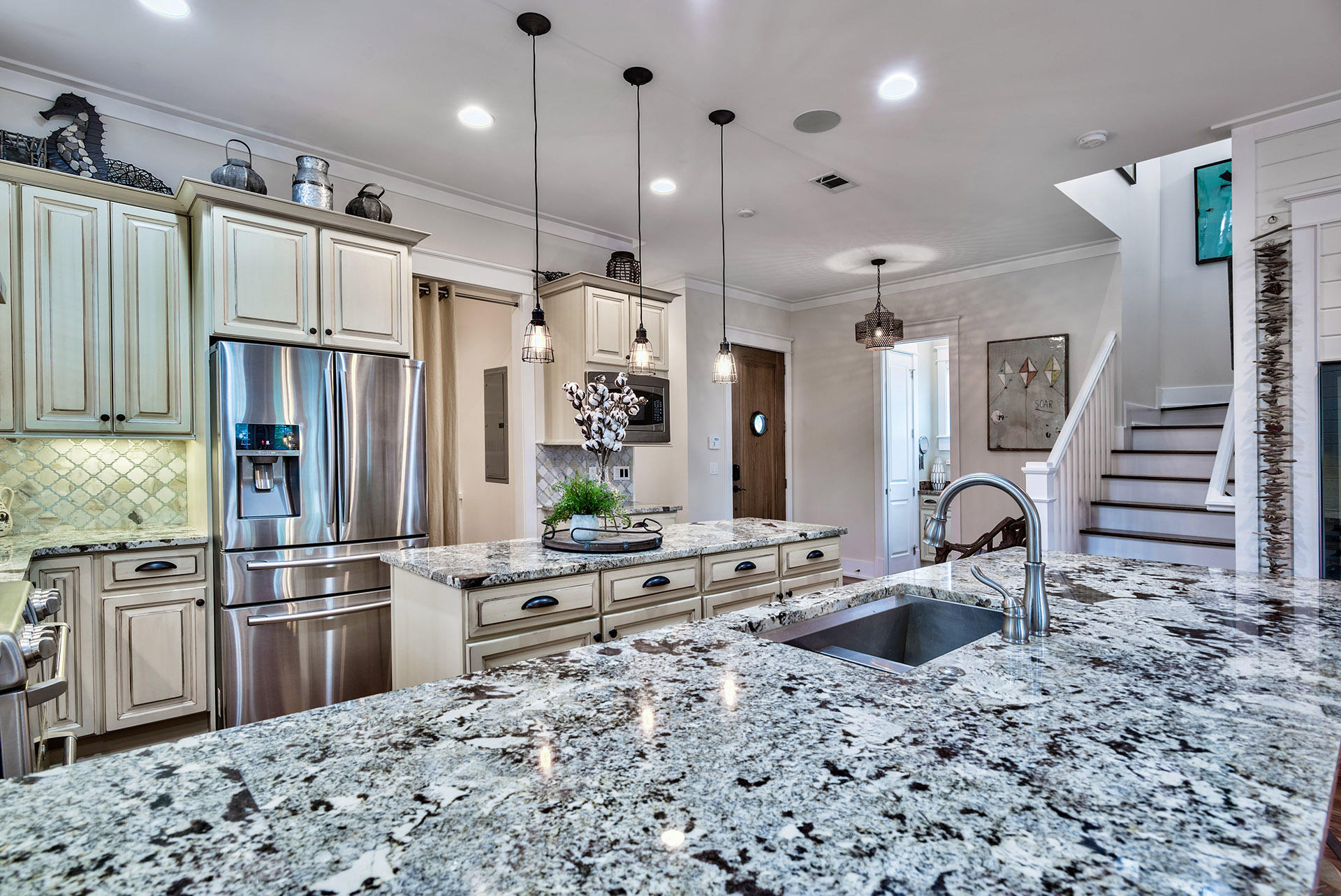 191 Plimsoll Way Santa Rosa Beach, FL 32459 - Photo 14 of 49 a kitchen with stainless steel appliances kitchen island granite countertop a refrigerator and a sink