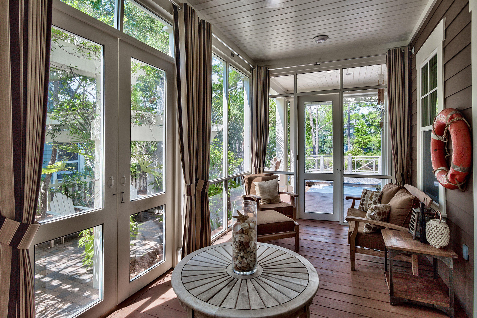 191 Plimsoll Way Santa Rosa Beach, FL 32459 - Photo 17 of 49 a living room with furniture a ceiling fan and a floor to ceiling window