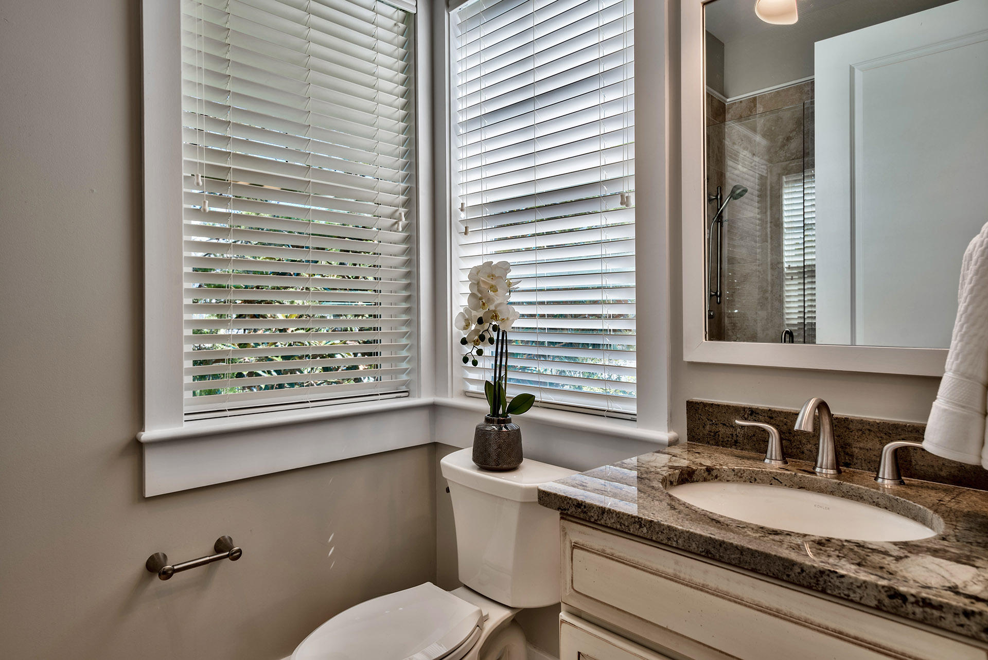 191 Plimsoll Way Santa Rosa Beach, FL 32459 - Photo 21 of 49 a bathroom with a granite countertop sink a toilet and a mirror