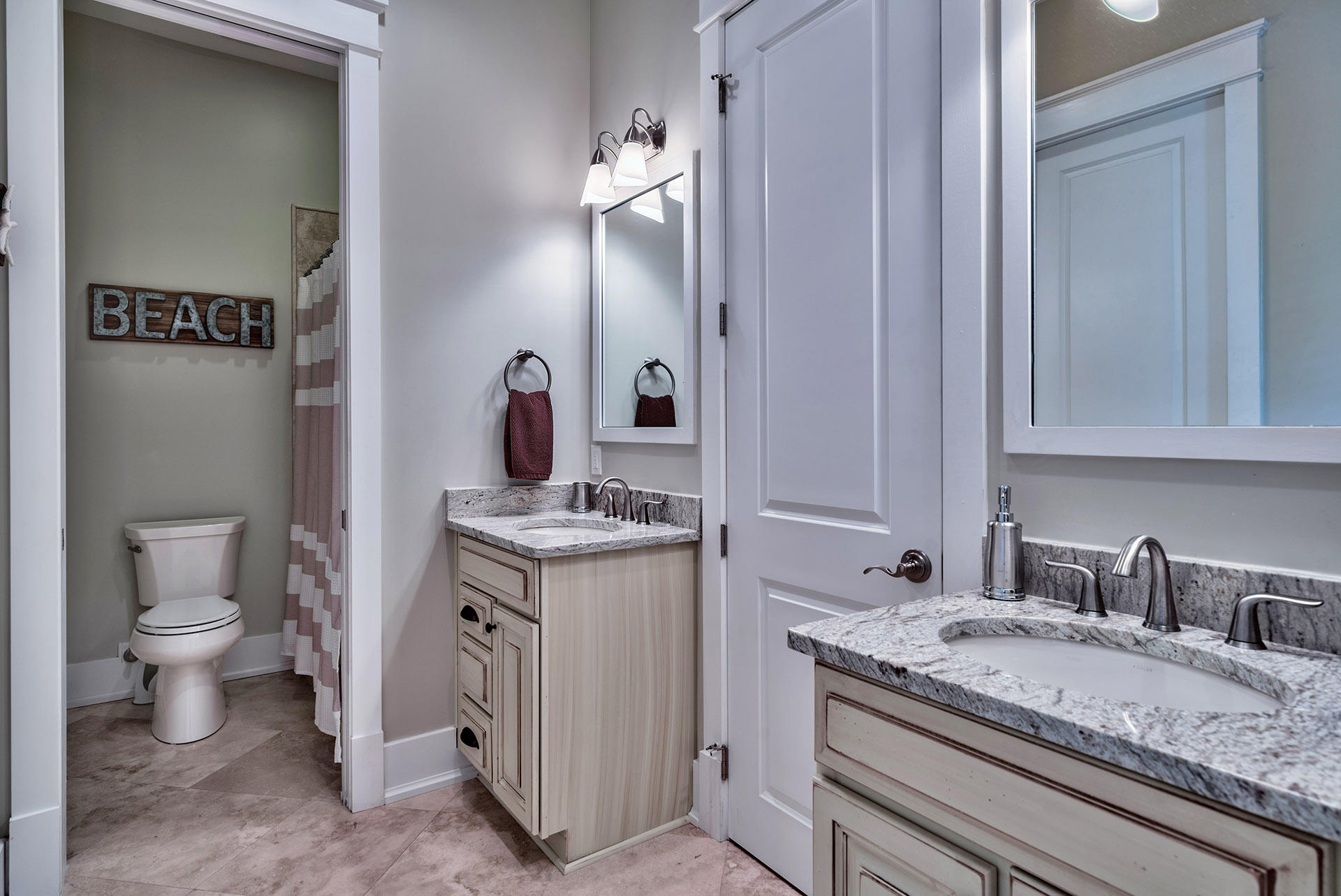 191 Plimsoll Way Santa Rosa Beach, FL 32459 - Photo 31 of 49 a bathroom with a granite countertop sink and a toilet
