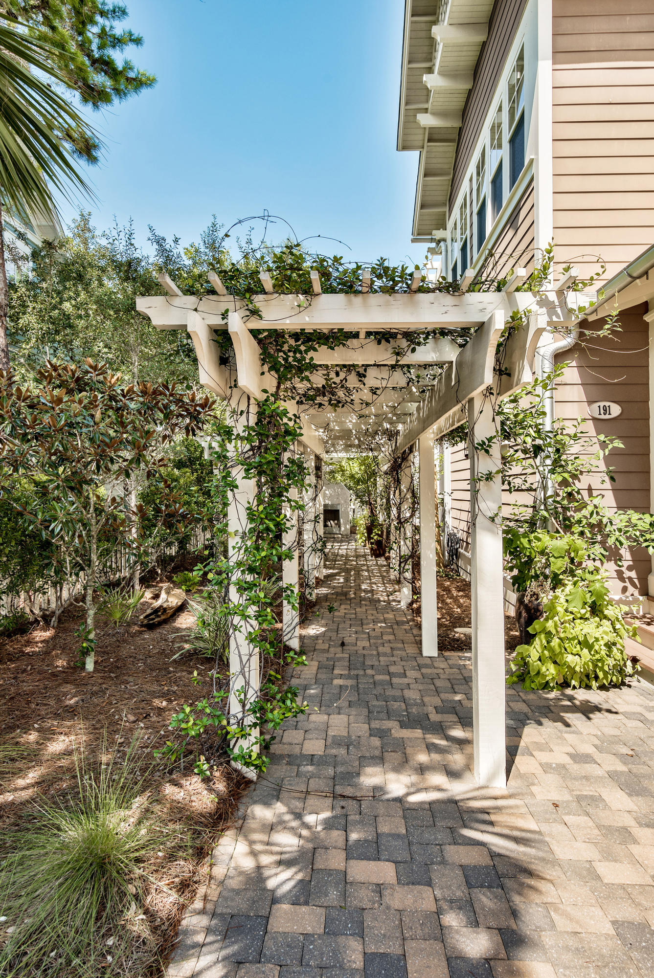 191 Plimsoll Way Santa Rosa Beach, FL 32459 - Photo 35 of 49 a view of a pathway with a building in the background