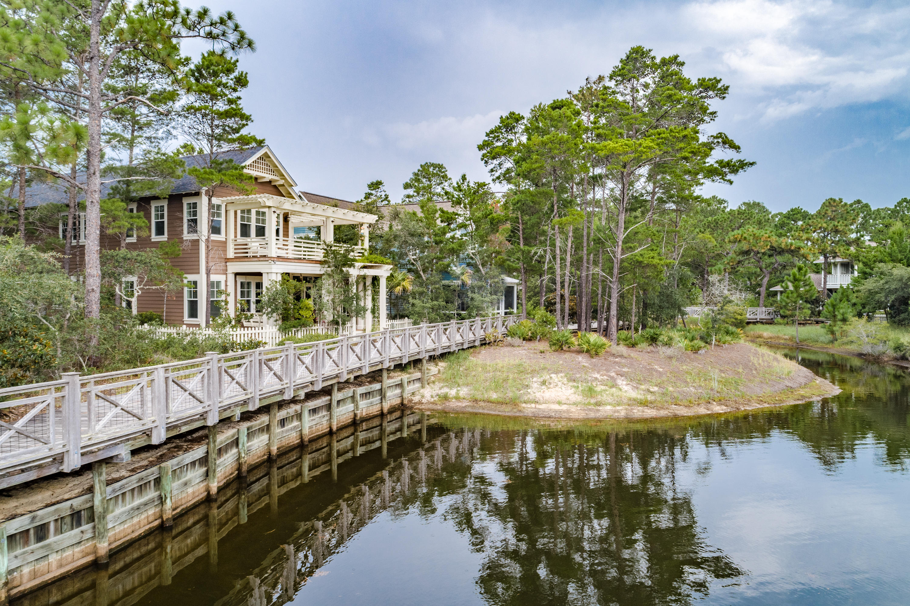 191 Plimsoll Way Santa Rosa Beach, FL 32459 - Photo 38 of 49 a view of swimming pool with lawn chairs and plants
