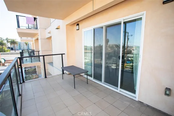 a view of balcony with furniture