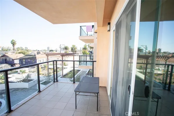 a view of a balcony with chairs
