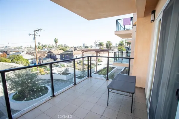an outdoor view from a balcony with furniture