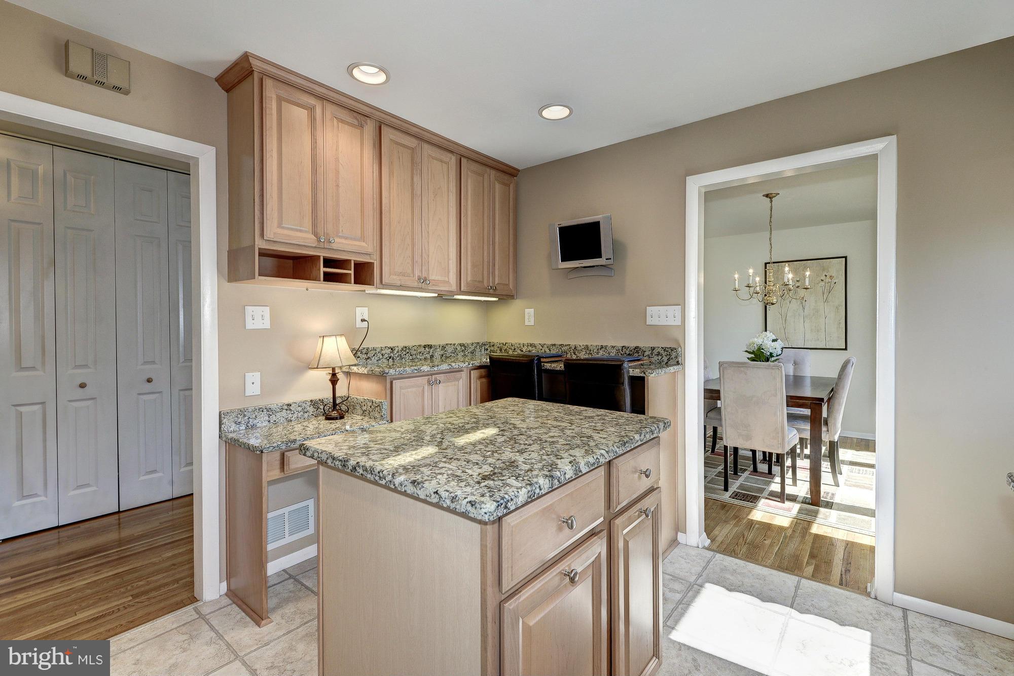 8307 Brixton Street Springfield, VA 22152 - Photo 7 of 30 Kitchen w/ 42" maple cabinets and granite counters