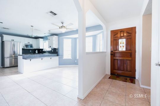 816 West Wasp Avenue Ridgecrest, CA 93555 - Photo 6 of 43 a large kitchen with cabinets and stainless steel appliances
