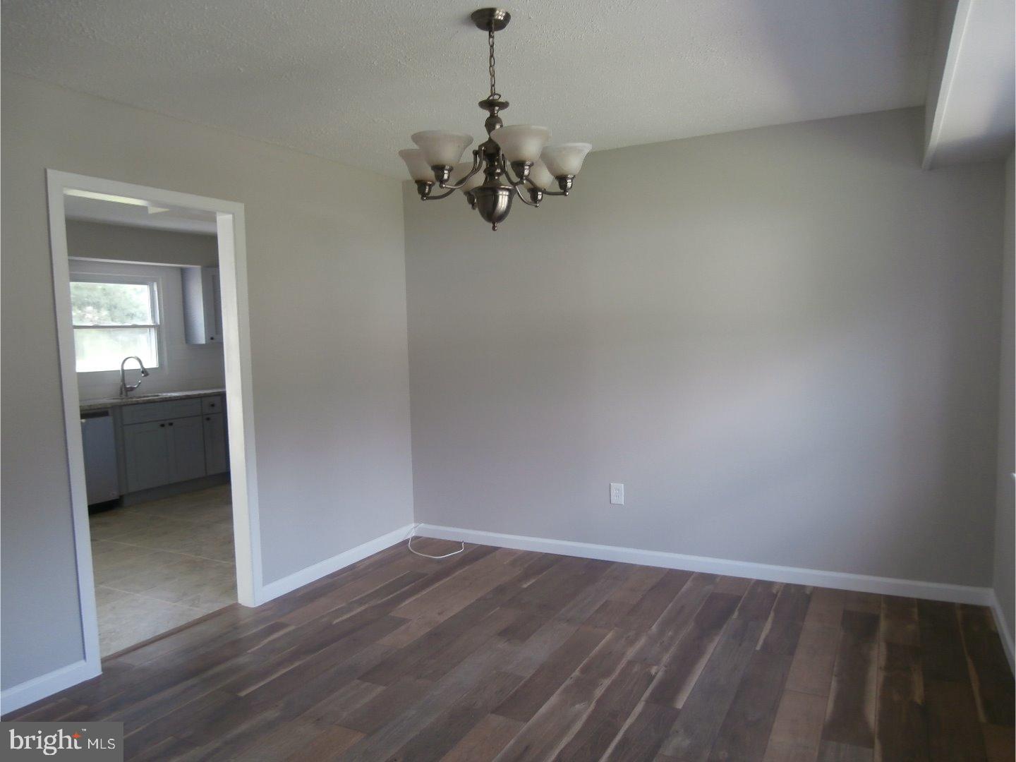 12 Hasting Lane Willingboro, NJ 08046 - Photo 5 of 13 wooden floor in an empty room with a window