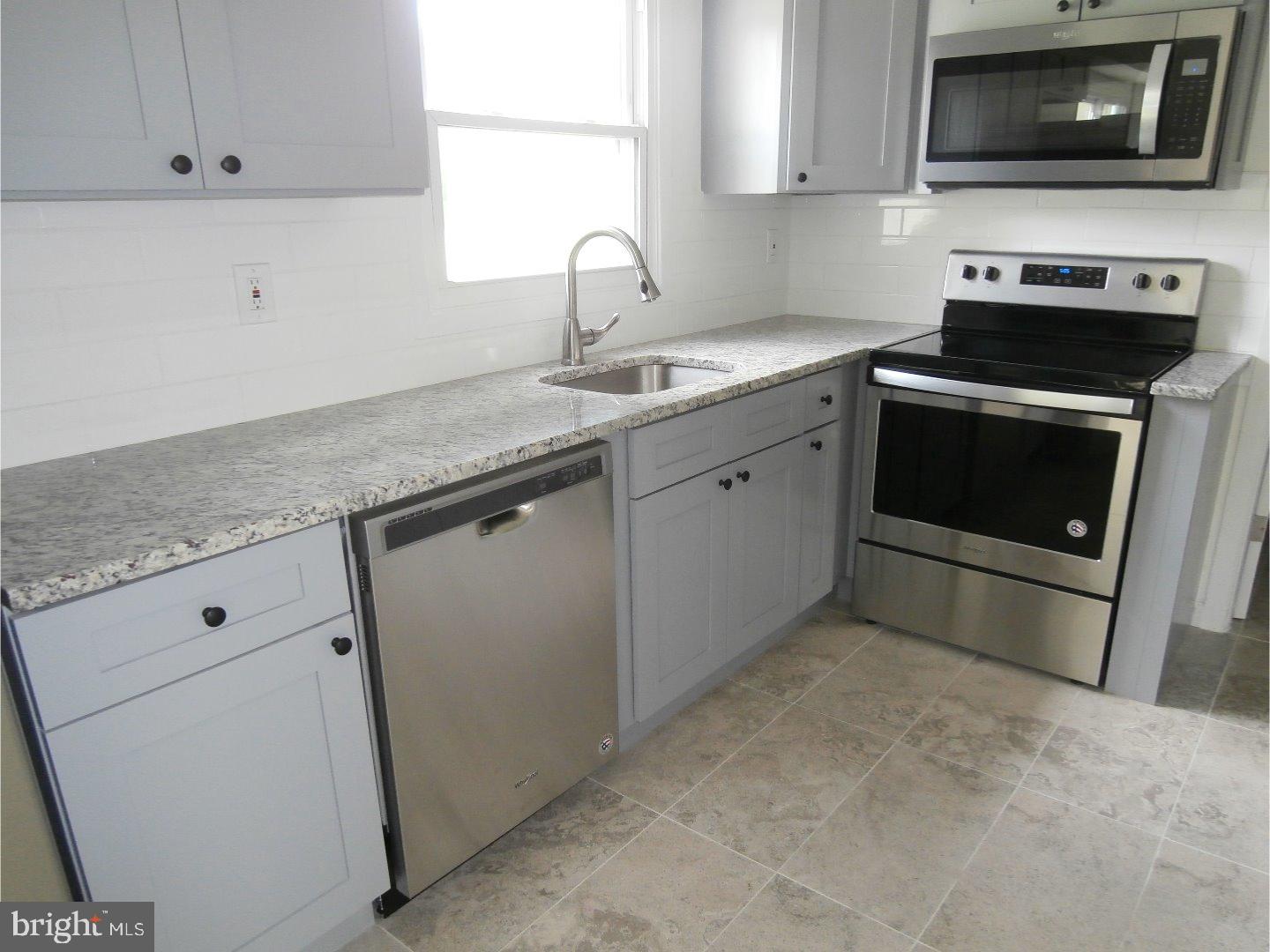 12 Hasting Lane Willingboro, NJ 08046 - Photo 6 of 13 a kitchen with granite countertop cabinets stainless steel appliances and a sink