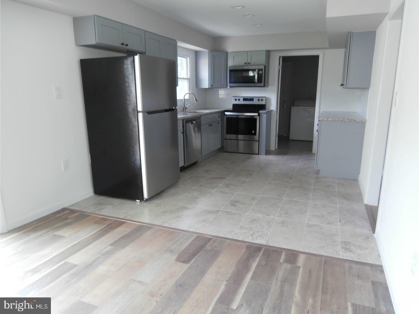 12 Hasting Lane Willingboro, NJ 08046 - Photo 7 of 13 a kitchen with stainless steel appliances a refrigerator and a stove