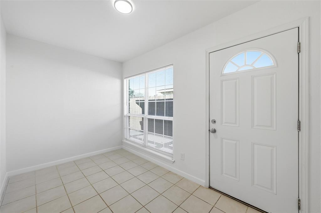 4645 Carr Street The Colony, TX 75056 - Photo 11 of 18 a view of an empty room with window