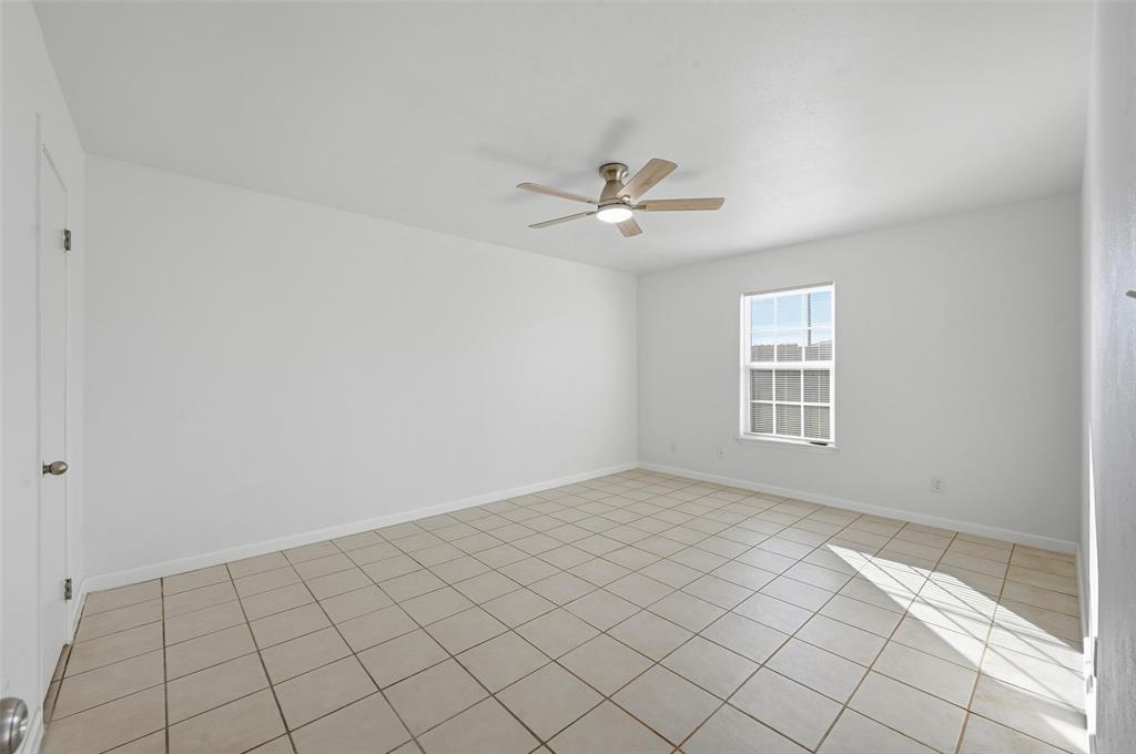 4645 Carr Street The Colony, TX 75056 - Photo 14 of 18 a view of an empty room with a window