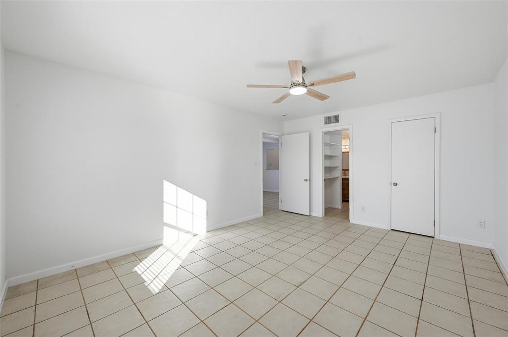 4645 Carr Street The Colony, TX 75056 - Photo 15 of 18 a view of an empty room and chandelier fan