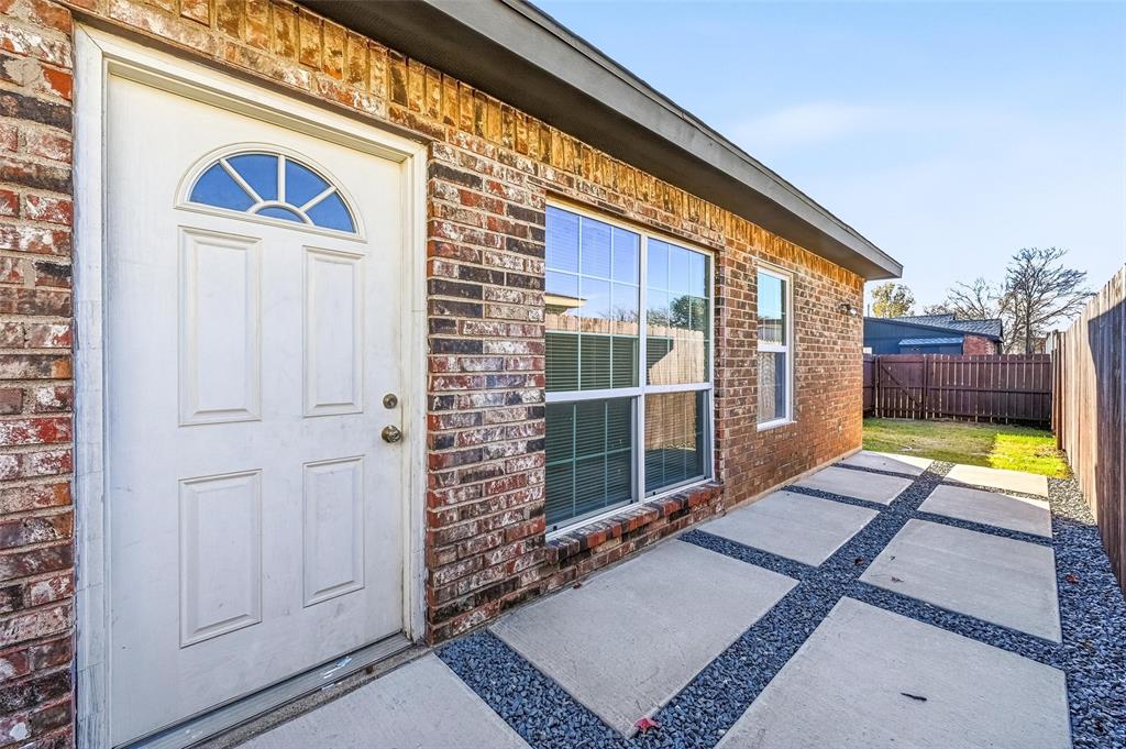 4645 Carr Street The Colony, TX 75056 - Photo 16 of 18 front view of a house with a balcony