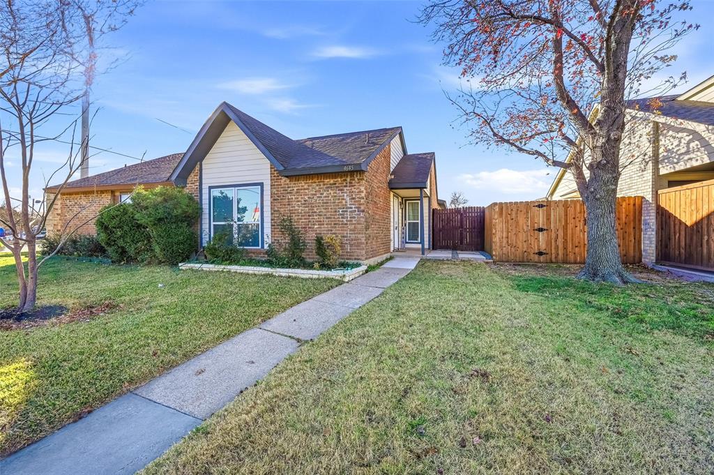 4645 Carr Street The Colony, TX 75056 - Photo 2 of 18 a front view of a house with garden