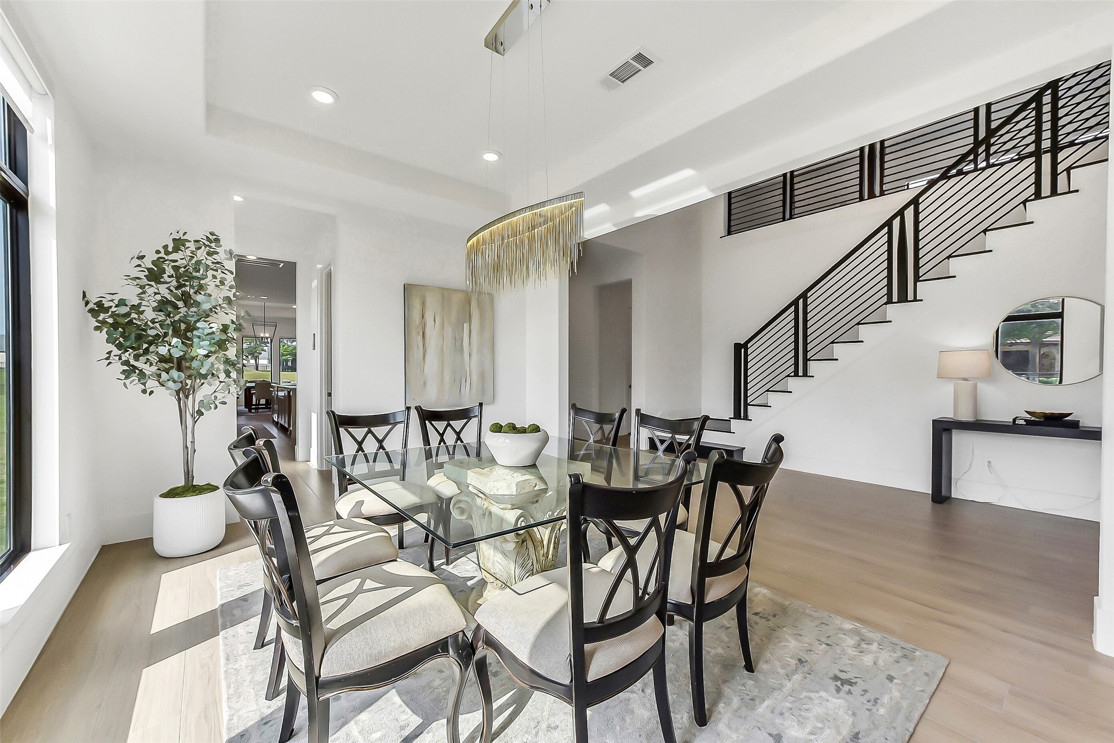 4903 Lagos Lagoon Way Spring, TX 77389 - Photo 11 of 49 Elegant dining with designer lighting and easy transition to the kitchen and family room.