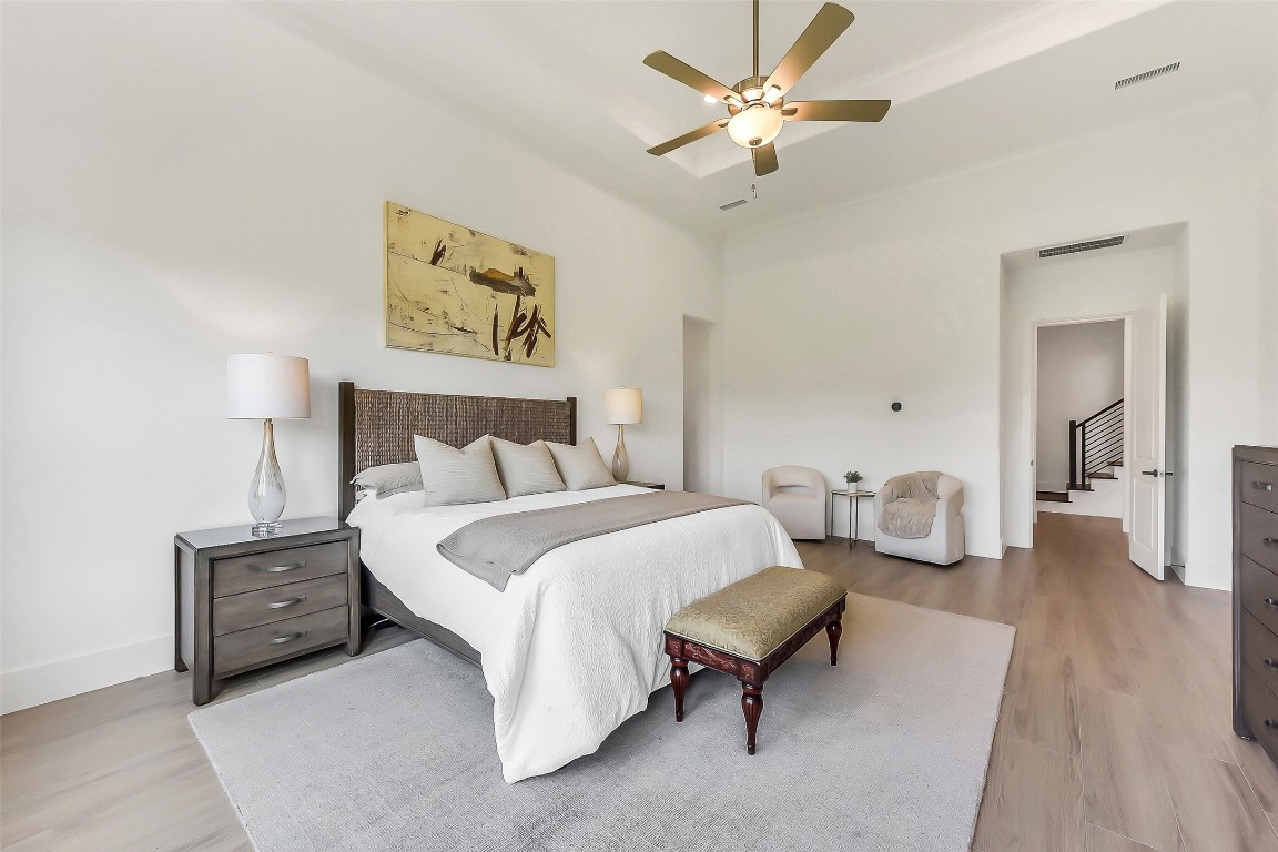 4903 Lagos Lagoon Way Spring, TX 77389 - Photo 24 of 49 A secondary staircase is thoughtfully positioned just outside the primary suite for added convenience.