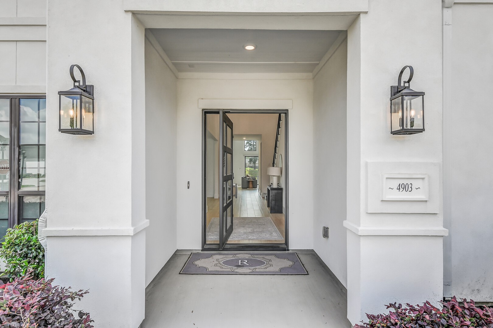 4903 Lagos Lagoon Way Spring, TX 77389 - Photo 5 of 49 Enter through the pivot-style door with sleek grid glass design.