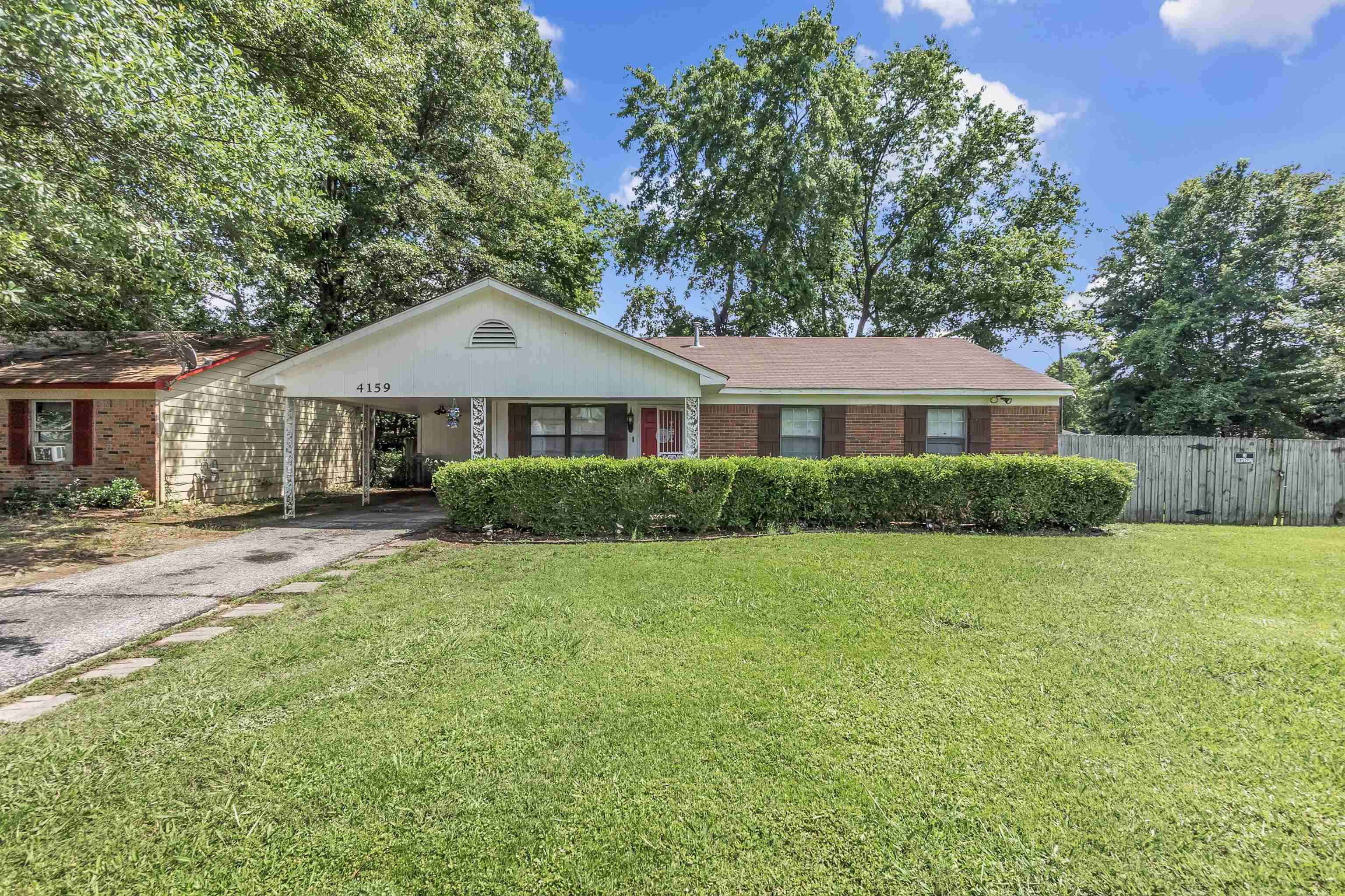 4159 Cochese Road Memphis, TN 38118 - Photo 1 of 18 a front view of a house with a yard and trees
