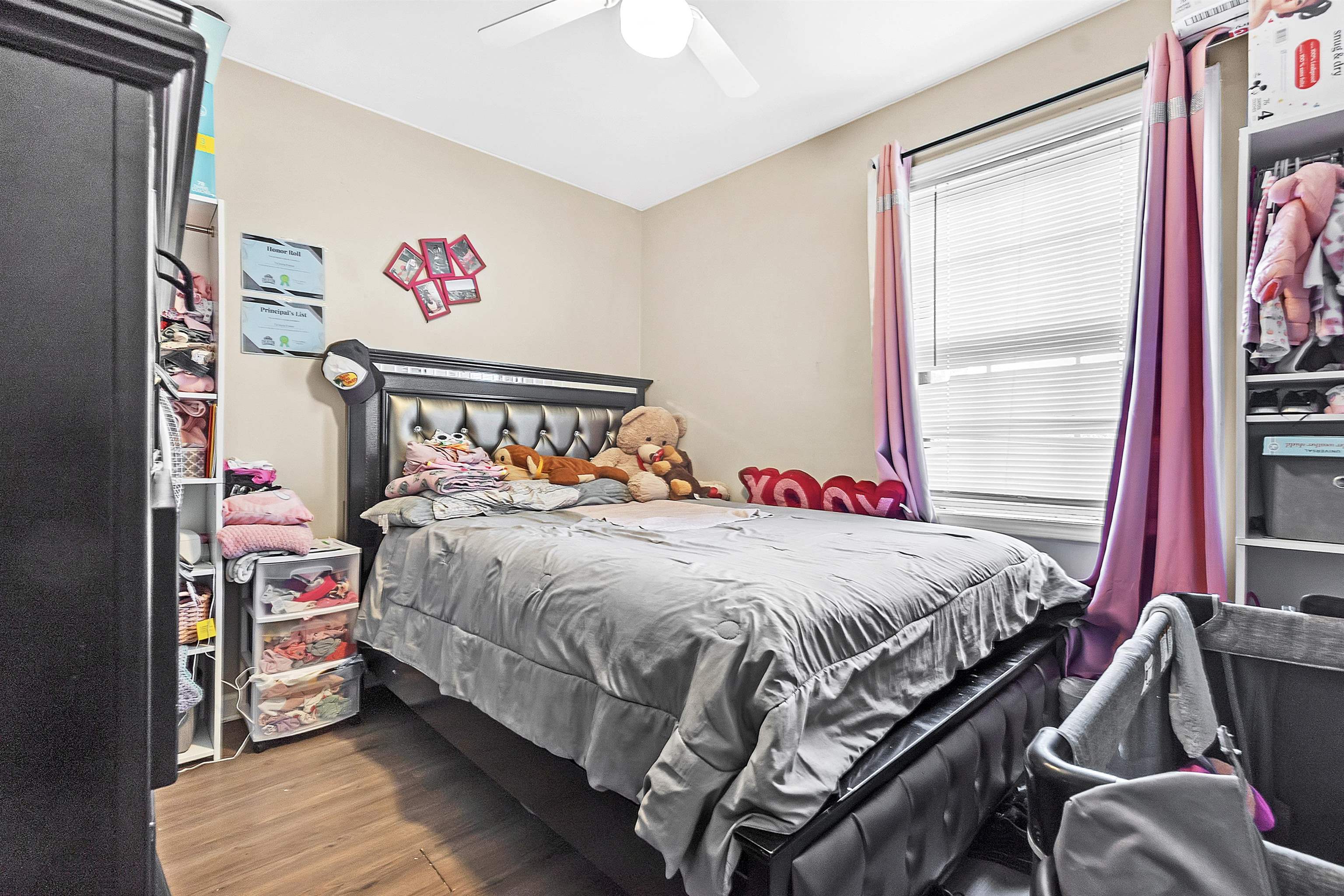 4159 Cochese Road Memphis, TN 38118 - Photo 15 of 18 a bed sitting in a bedroom next to a window