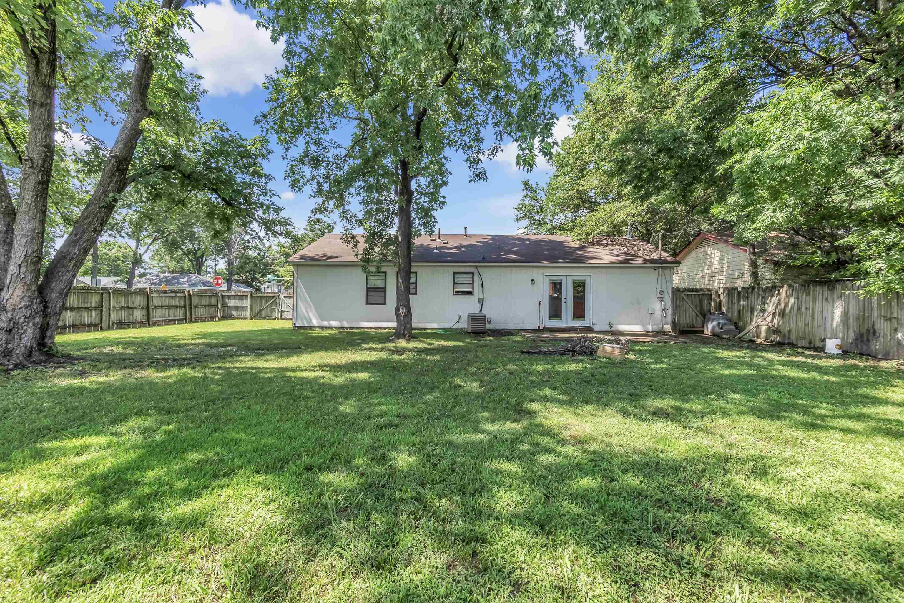 4159 Cochese Road Memphis, TN 38118 - Photo 16 of 18 a front view of a house with yard and green space