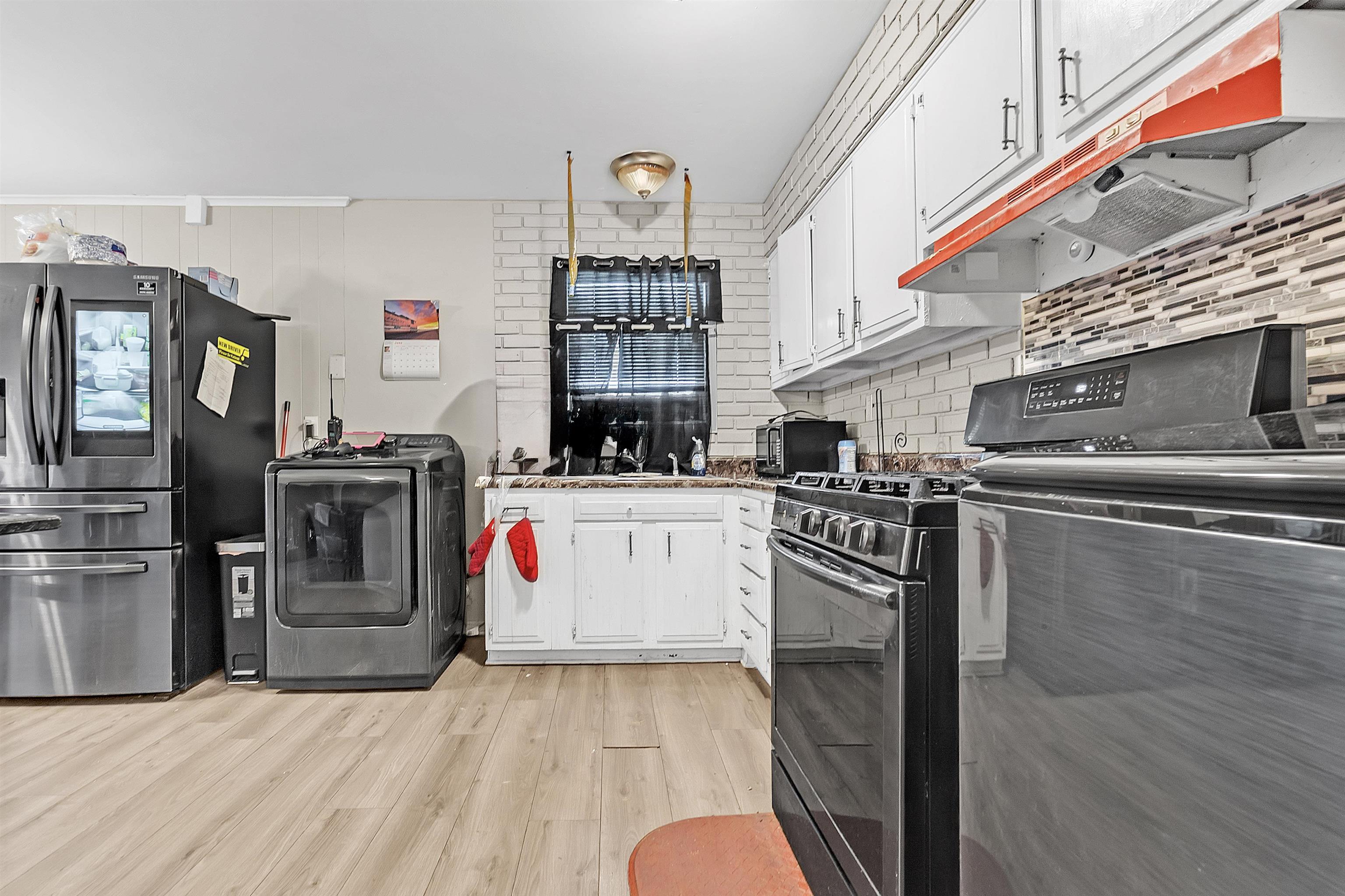 4159 Cochese Road Memphis, TN 38118 - Photo 8 of 18 a kitchen with stainless steel appliances granite countertop a stove and a refrigerator