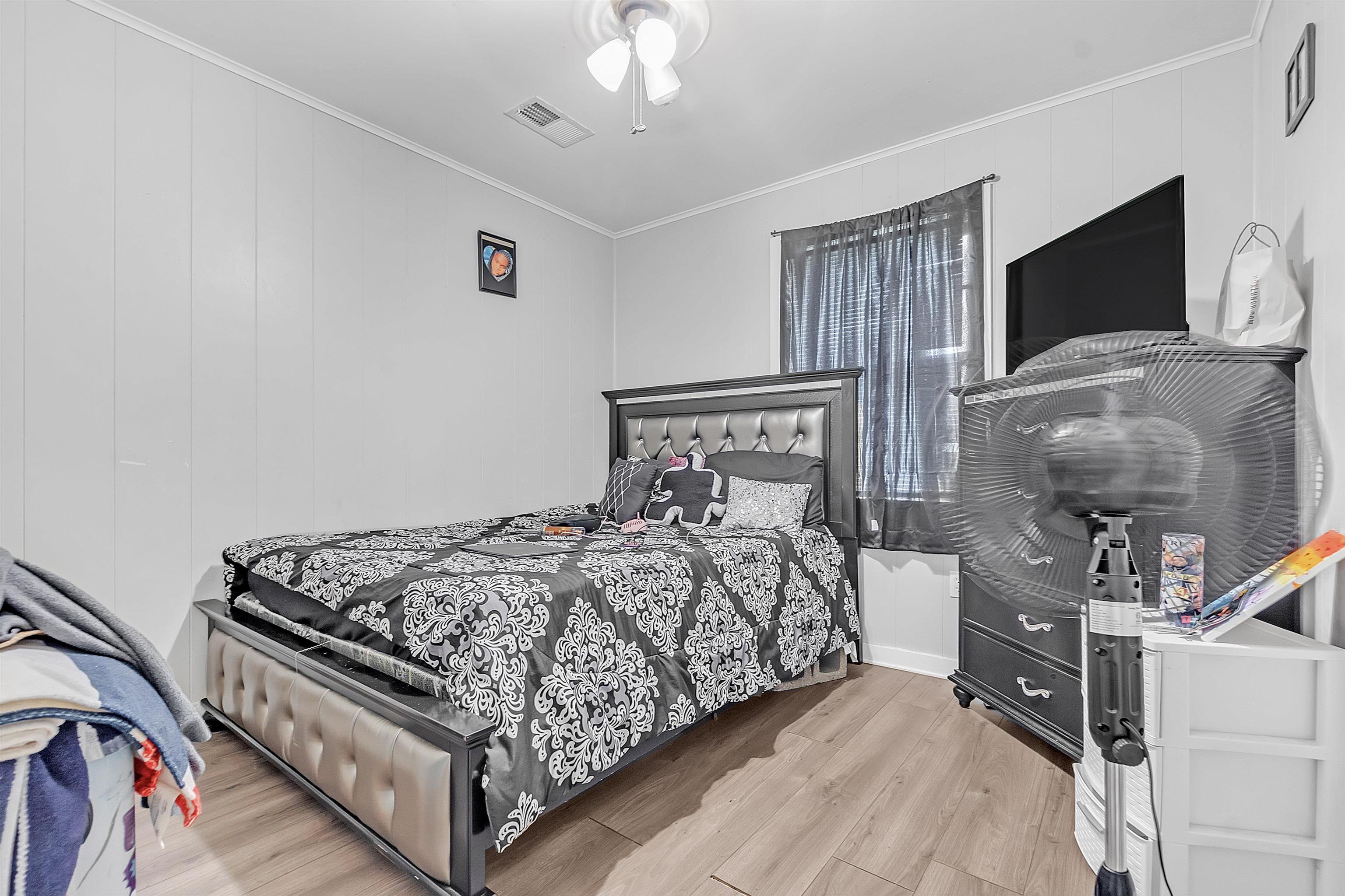 4159 Cochese Road Memphis, TN 38118 - Photo 10 of 18 a bed sitting in a bedroom and tv