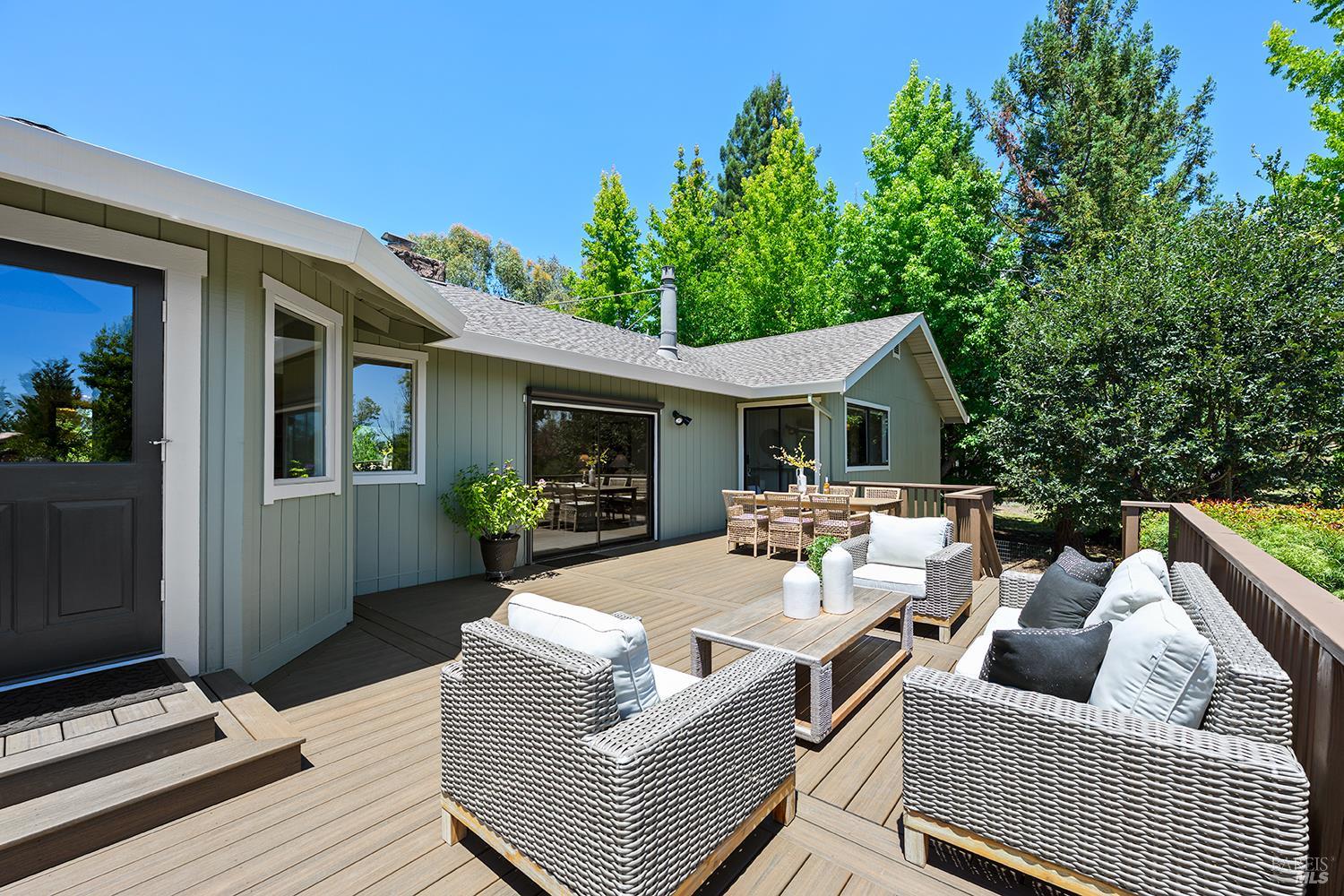 7595 Giusti Road Forestville, CA 95436 - Photo 16 of 41 a view of a patio with couches table and chairs and potted plants