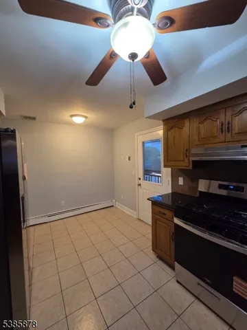 a kitchen with stainless steel appliances granite countertop a sink and cabinets