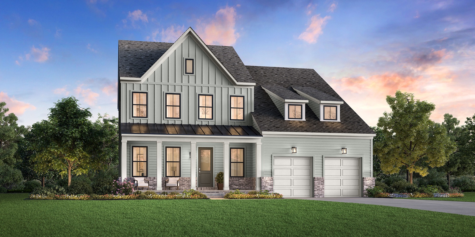 a front view of a house with a yard and green space