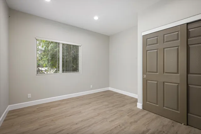 a bathroom with a granite countertop sink a toilet and bathtub
