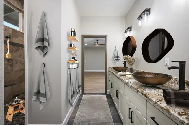 a kitchen with a granite countertop sink and a refrigerator