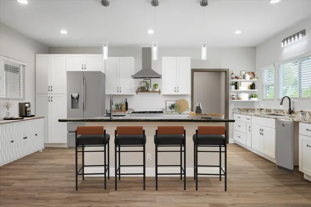 a kitchen with stainless steel appliances granite countertop wooden floor and white cabinets