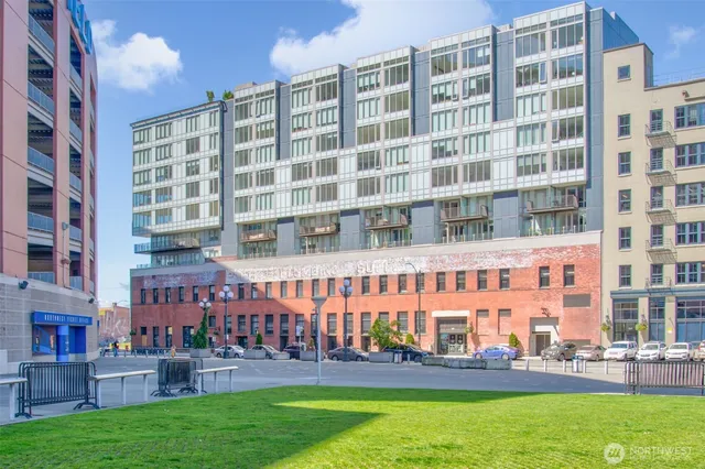 front view of an apartment building with a yard
