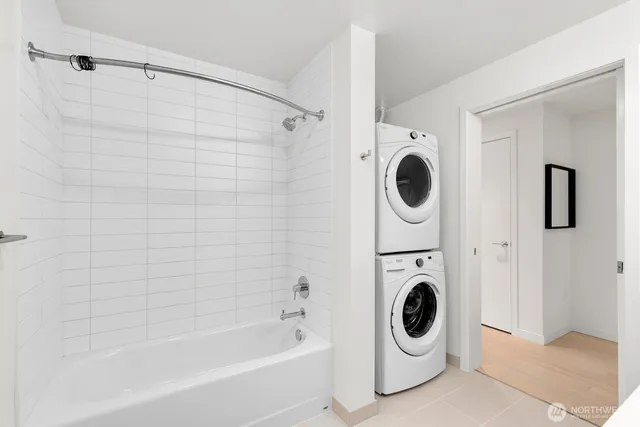 a bathroom with a sink a mirror and a bathtub