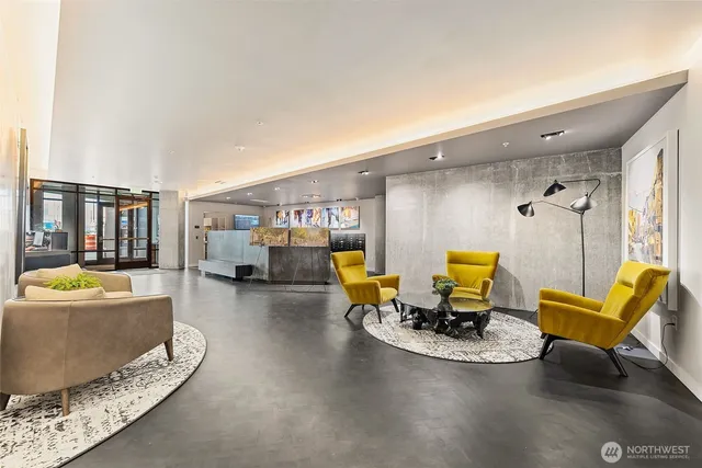 a view of a balcony with two chairs and a table