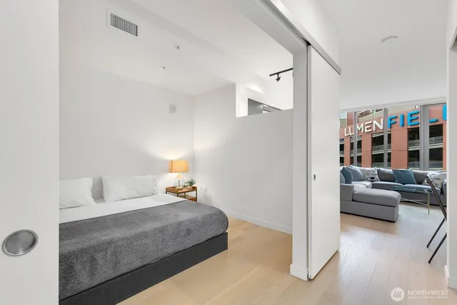 a bedroom with a bed and couch