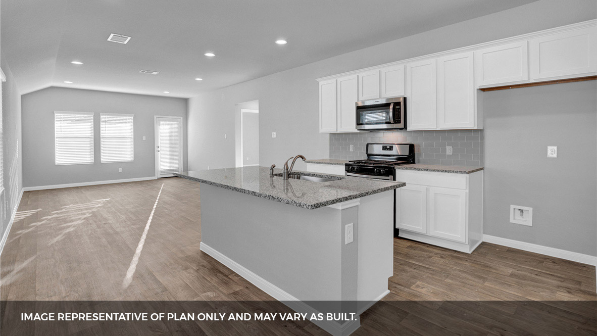 268 Mountain Pea Road Kyle, TX 78640 - Photo 3 of 18 a kitchen with granite countertop a sink and a stove top oven