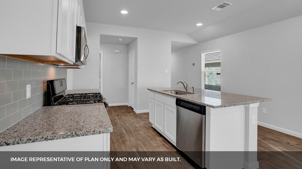 268 Mountain Pea Road Kyle, TX 78640 - Photo 6 of 18 a kitchen with a sink stove and refrigerator