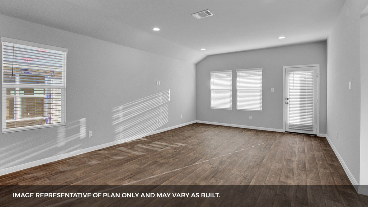 268 Mountain Pea Road Kyle, TX 78640 - Photo 9 of 18 an empty room with wooden floor and windows