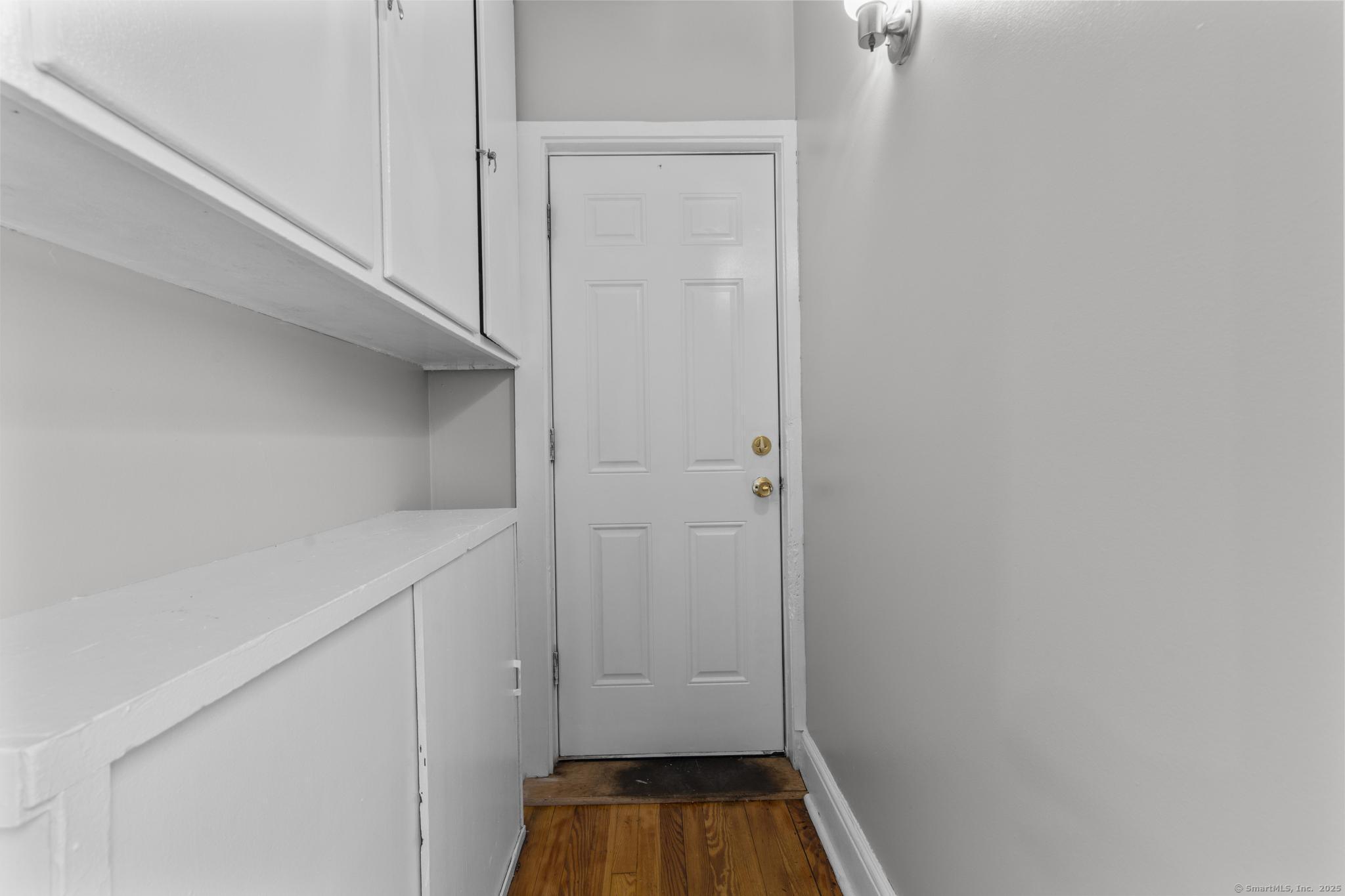 857 Noble Avenue, Unit 1 Bridgeport, CT 06608 - Photo 15 of 16 a view of walk in closet with empty racks
