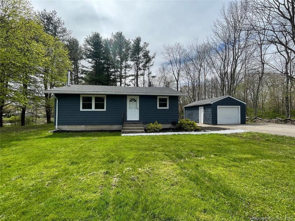 19 Brook Road Scotland, CT 06264 - Photo 1 of 1 a front view of house with yard and trees