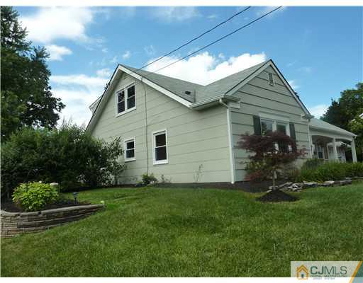 10 Larsen Road Somerset, NJ 08873 - Photo 22 of 23 a front view of house with a garden
